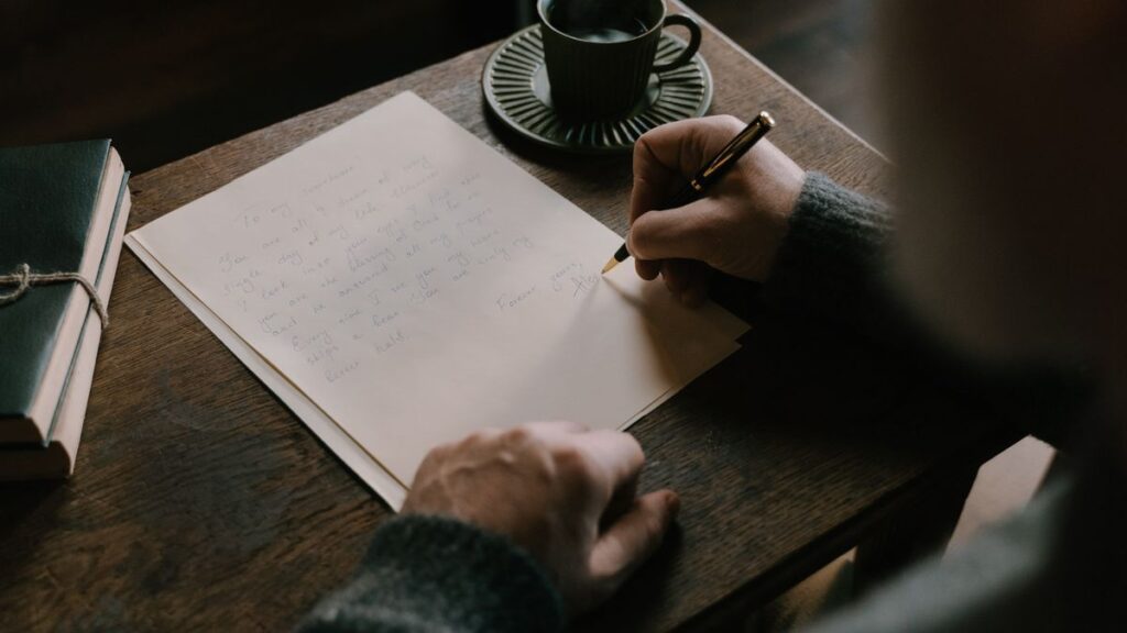 Person learning how to write leave application at a desk with coffee
