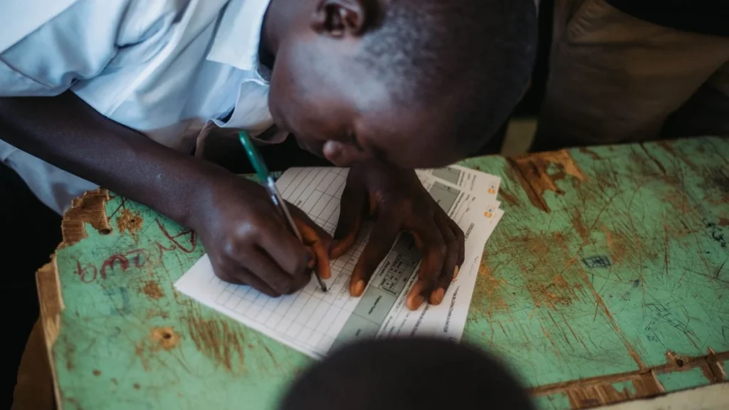 Patra lekhan practice by a student writing in a notebook